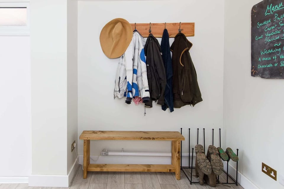 The entrance hall has plenty of space for shoes, boots and coats.