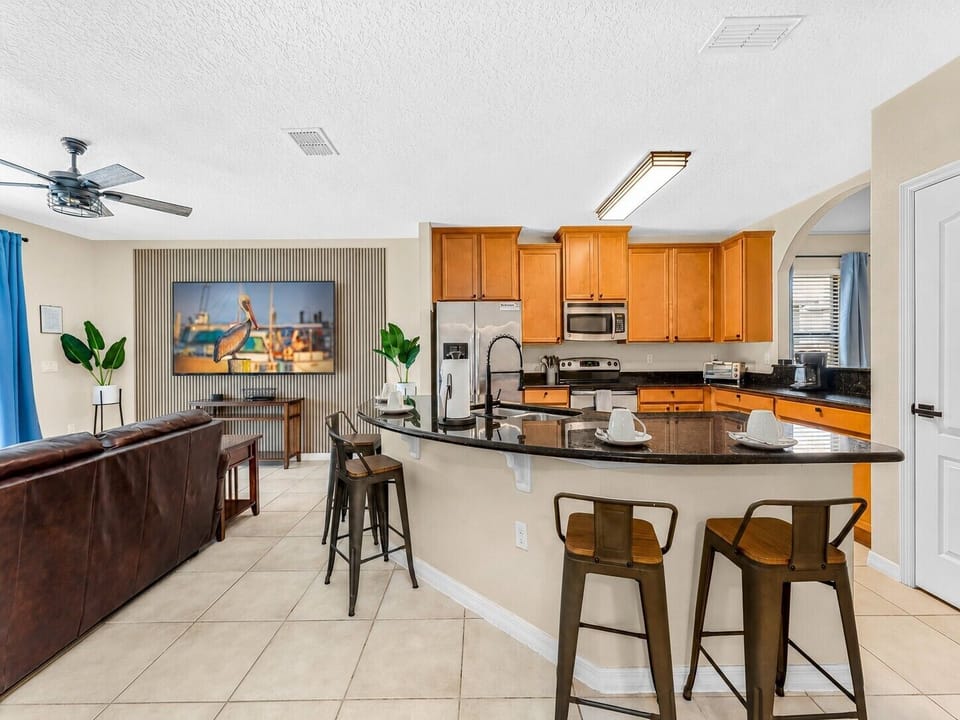 Downstairs:  kitchen and living room with 64in smart tv