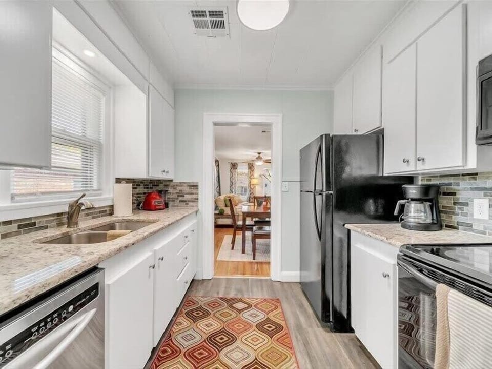 Step into our well-furnished kitchen, a haven for culinary enthusiasts and design lovers alike
