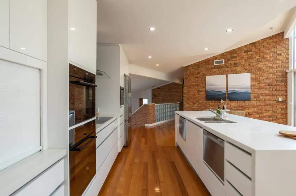 Fully equipped kitchen featuring 2 stoves and two dishwashers