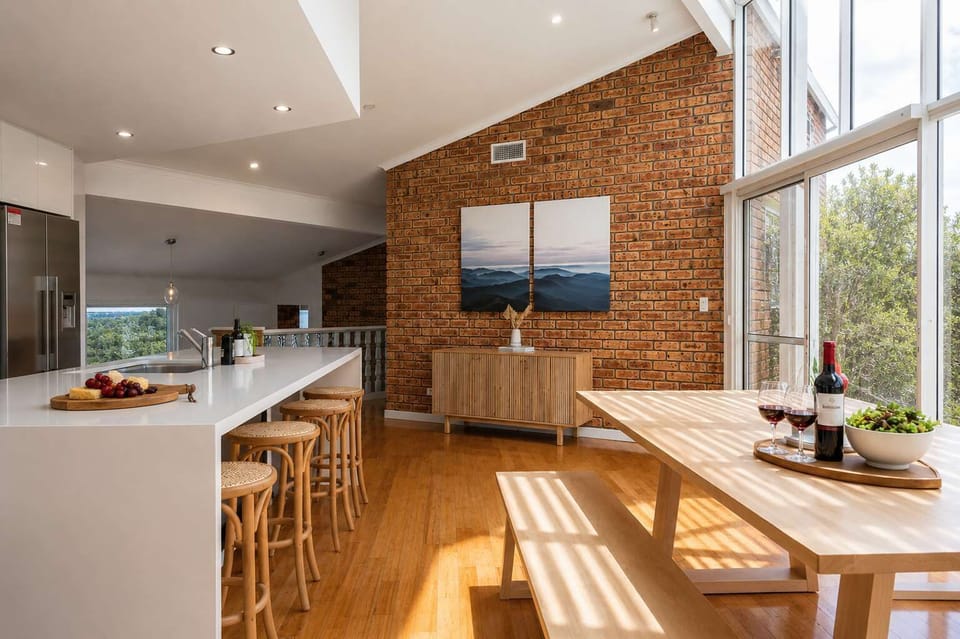 Large Timber Dining table and modern Kitchen