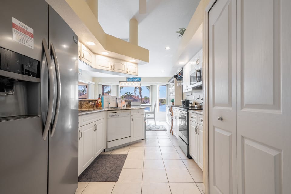 Large side by side refrigerator/freezer with in the door ice & water dispenser. Large electric oven with stove top ,dishwasher, Insinkerator garbage disposal. Separate water dispenser on sink is for the reverse osmosis  drinking water only .
