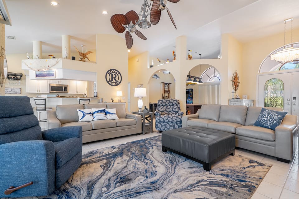 Soaring ceilings in this open concept luxurious Florida home . ALL NEW furnishings in 2023 including queen memory foam mattress hide-a-beds in the 2 leather couches . New brushed nickel Twinstar dual vertical ceiling fan with cherry color palm woven blades moves lots of air .
Both Lazyboy chairs are new in 2023 and one is a big/tall model with fully automatic remote control.
