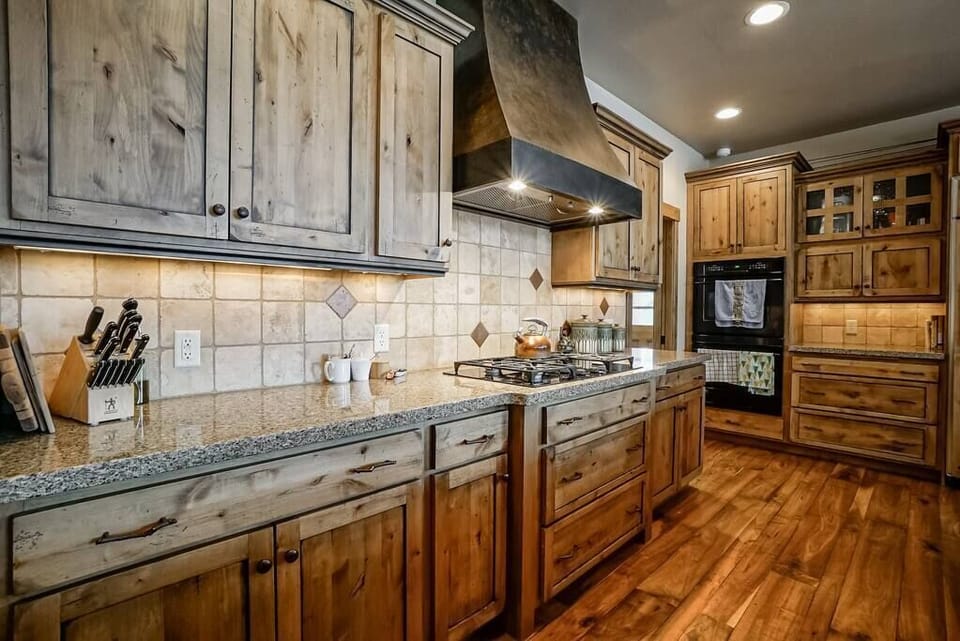 Find ample space to prepare delicious dishes on the gleaming granite countertops.