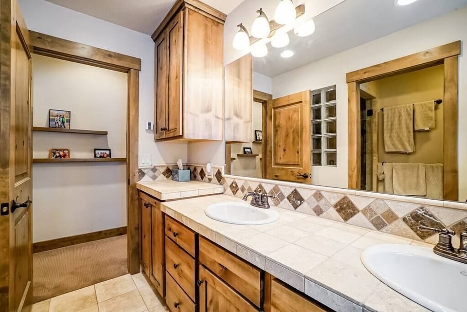 The sparkling en-suite master bathroom includes a double vanity, and walk-in shower. (1)