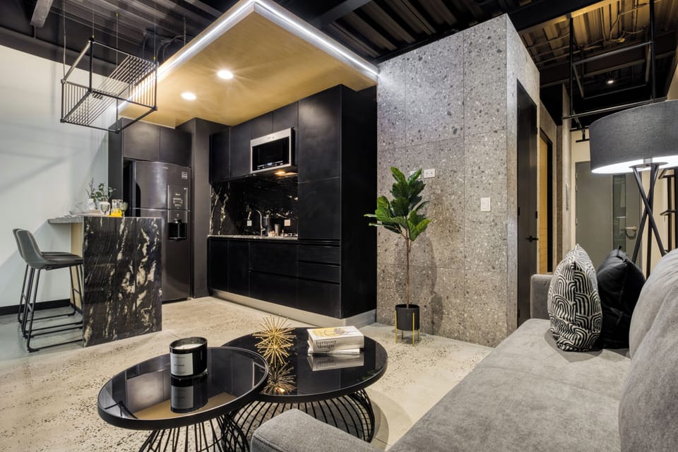 Stylish Apartment with a Private Balcony | Living area | 55-inch Smart TV with digital channels