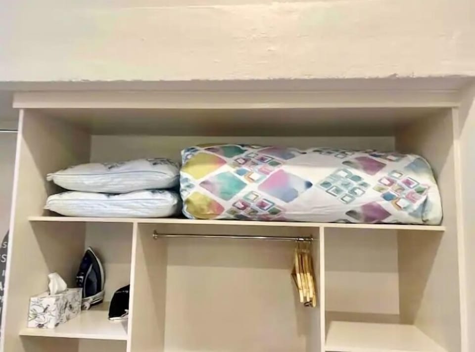 Spare blanket/Pillows. Hairdryer, iron, ironing board, fan/heater and umbrella.