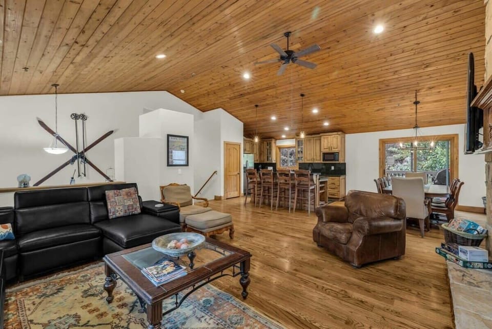 The home features an open-concept layout allowing for easy interaction between the kitchen, living, and dining areas.