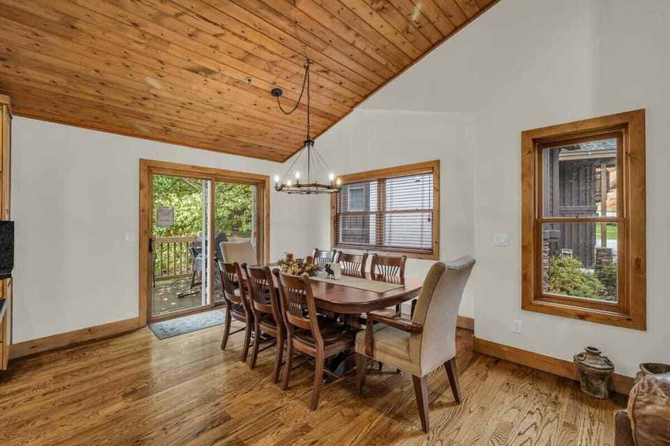 The dining area is conveniently located between the living room and kitchen and features seating for 8.