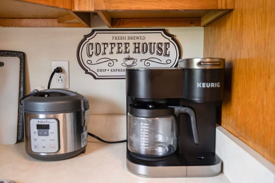 Start your morning right with a cup of coffee from this cozy corner, perfect for sipping and enjoying the peaceful surroundings.