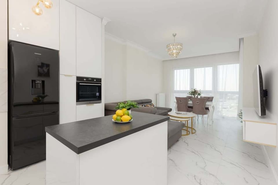 Kitchenette with plenty of kitchen utensils and dishes. 