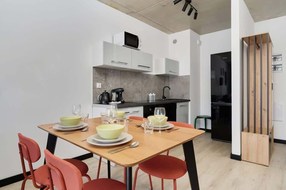Large table with chairs for eating communal meals. 
