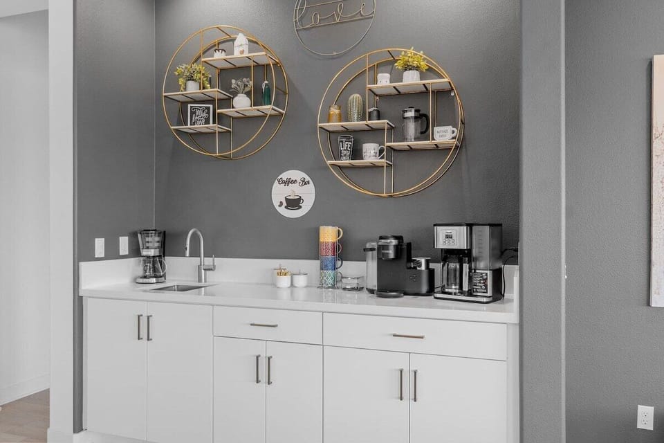 Built-in coffee bar with round mirrors—start mornings right with espresso and fairway views.