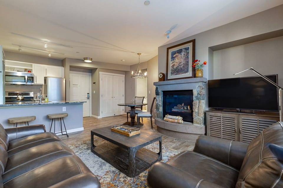Sink into plush leather seating by your crackling fireplace while dinner simmers in the fully equipped kitchen behind you.