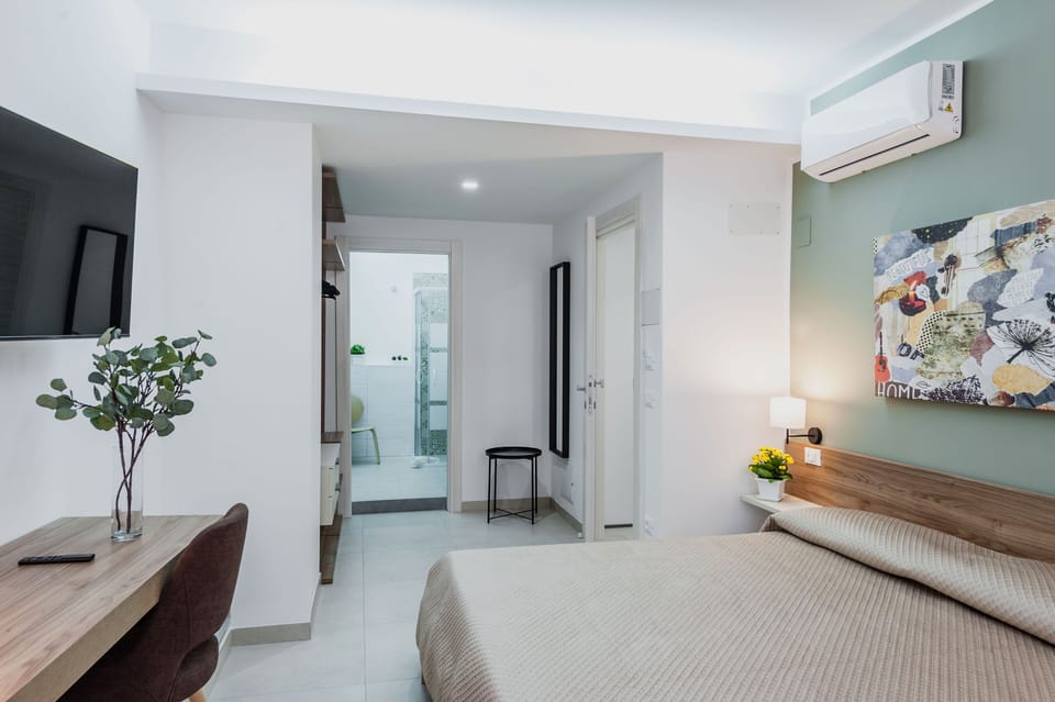 Deluxe Room | Individually furnished, desk, laptop workspace, blackout drapes