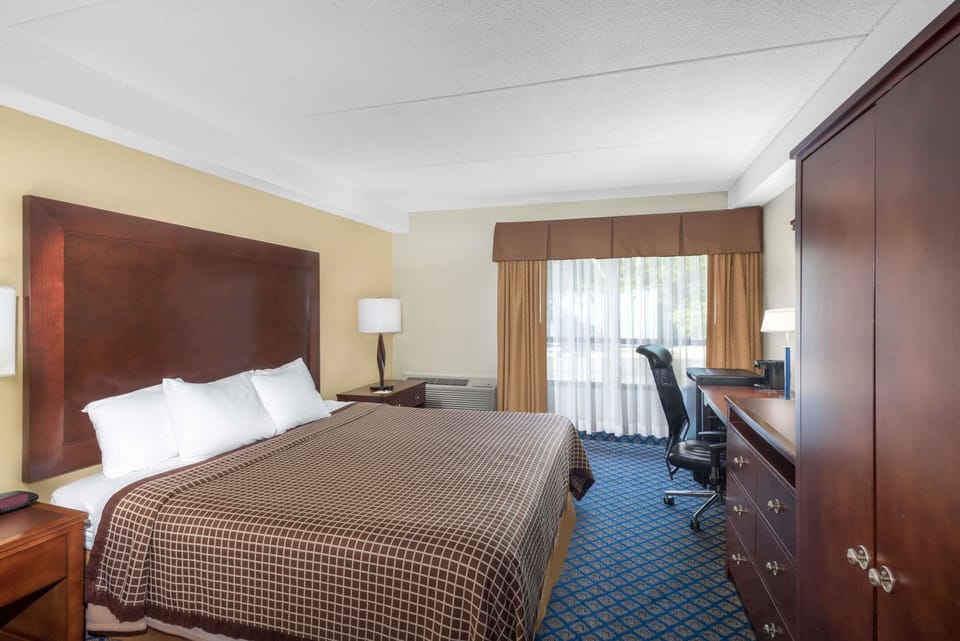 Desk, laptop workspace, blackout drapes, iron/ironing board