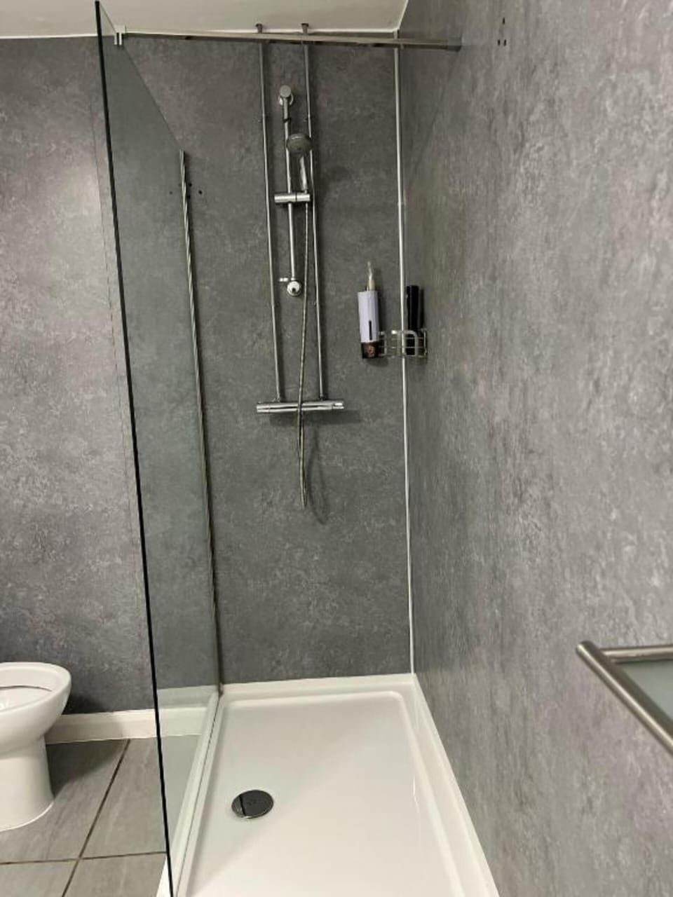 Shower, towels, soap, toilet paper