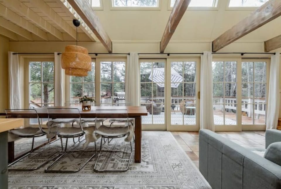 The dining area facing south with a deck view.