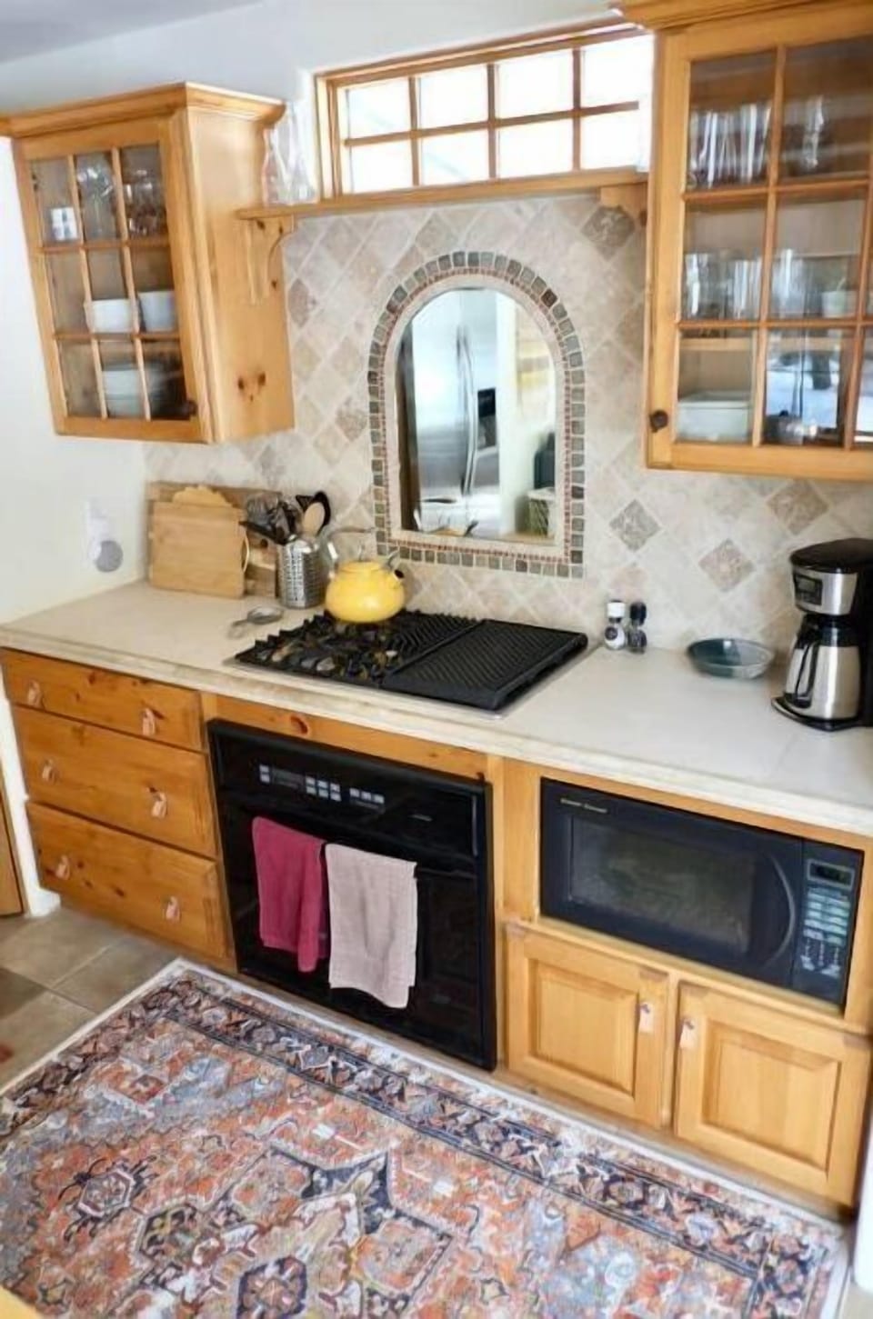 Stove, oven, Coffee maker, and tea kettle.