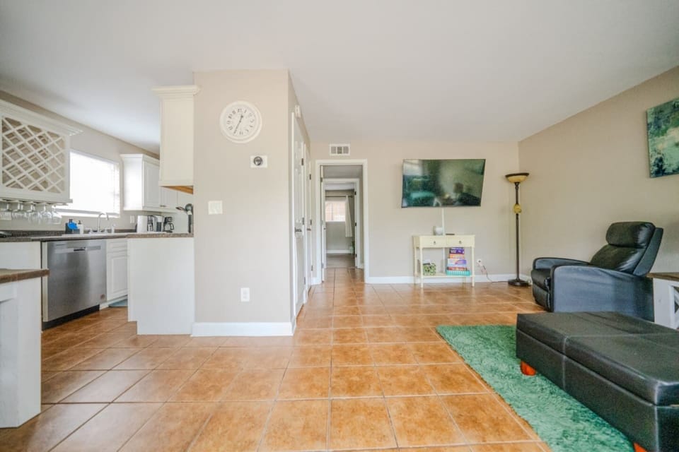 Living room with full size pull out couch (firm). 58” TV. No streaming/cable/satellite provided. Must use your own accounts to watch TV.