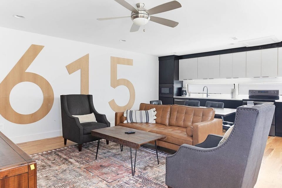 Local pride meets modern comfort in this bold living space.