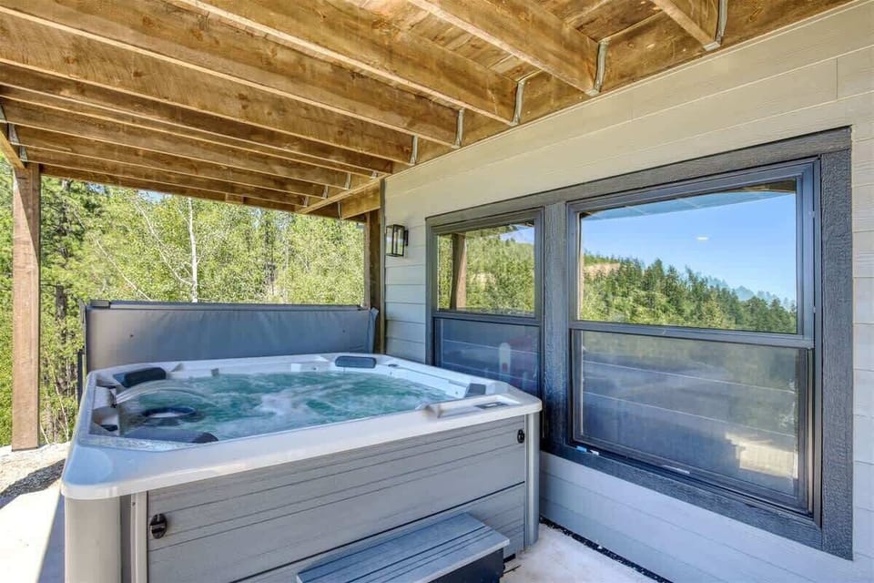 Square hot tub on the lower patio- perfect place to relax after a long day of hiking or skiing