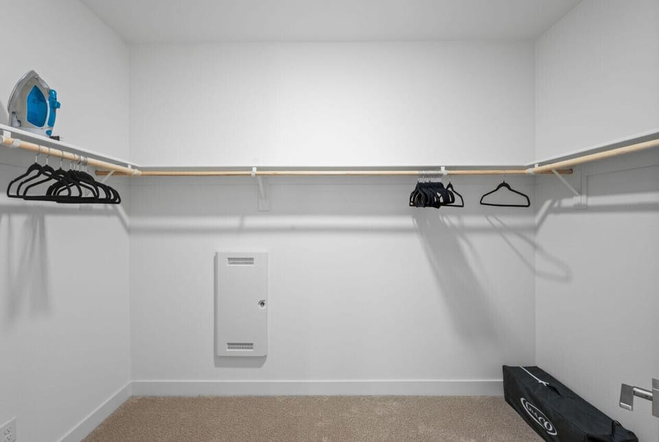 Walk-in closet w/ hanging space & shelving to keep everything organized