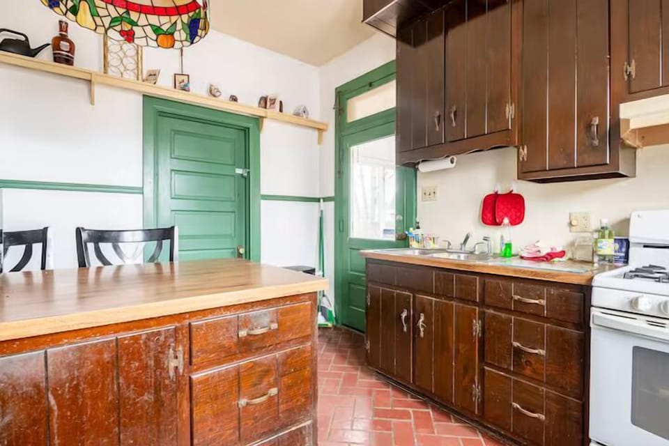 Charming Kitchen: Savor meals in style with rustic wood details and bright, inviting space!