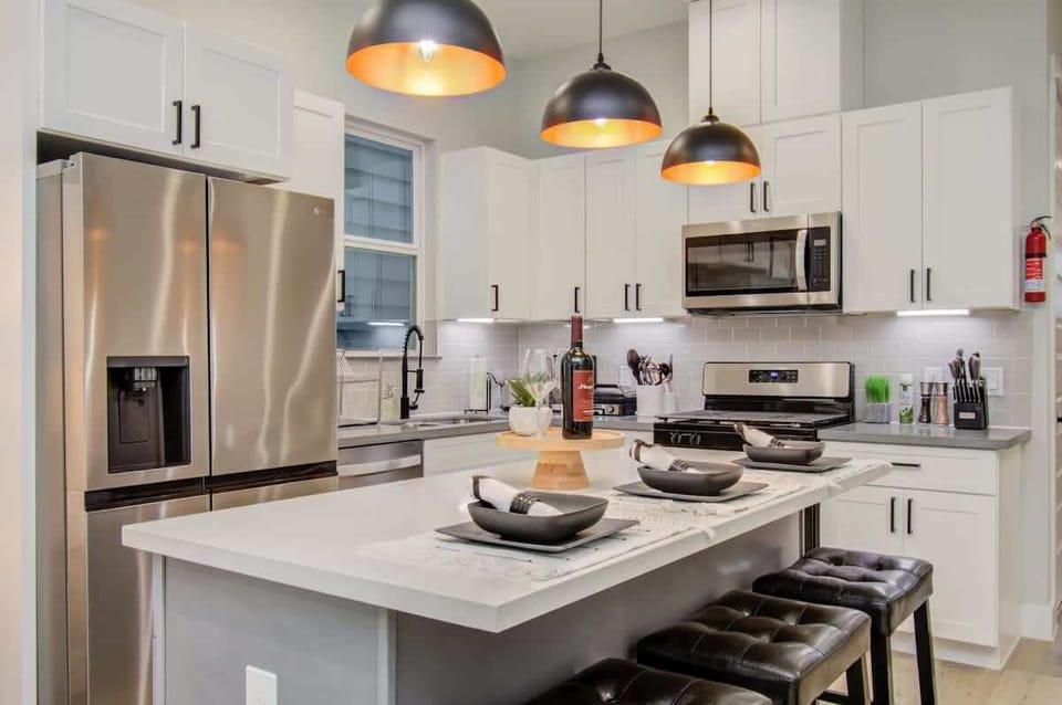 Jaw-droppingly stunning, this fully equipped gourmet kitchen stands as the heart of the home with a functional center kitchen island designed for entertaining.