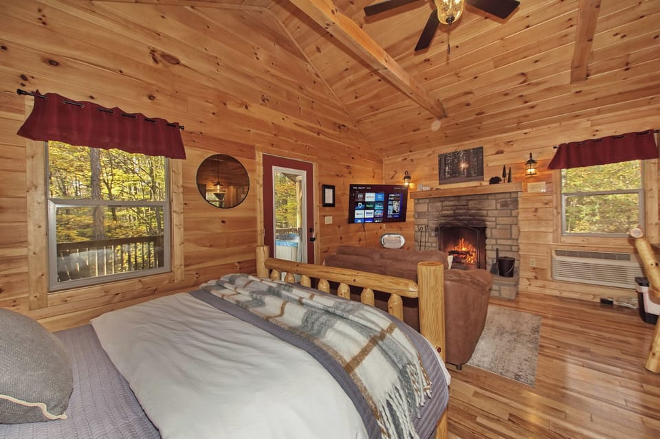 Relax in this cozy cabin with warm wood interiors, a roaring fireplace, and all the comforts of home. Perfect for a peaceful retreat in nature!