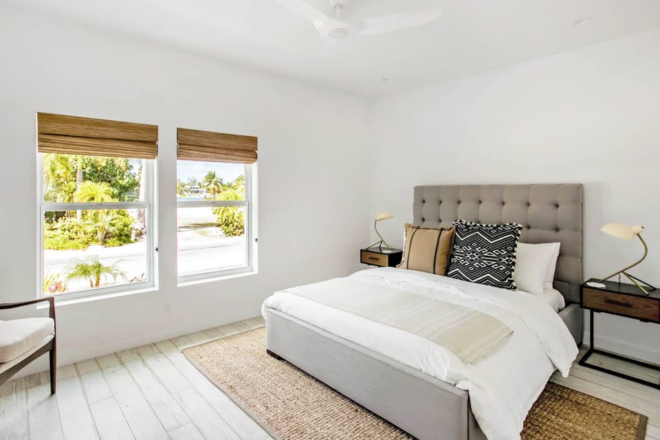 Bedroom #2 on the lower level with island views and a queen bed.