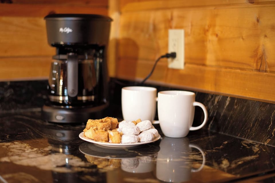 Start your morning with a fresh brew and sweet treats in the cozy kitchen.