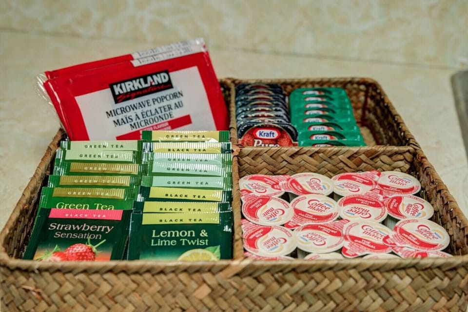 Assortment tray with Popcorns, Jam, Peanut butter, Creamer and Multi flavored premium tea