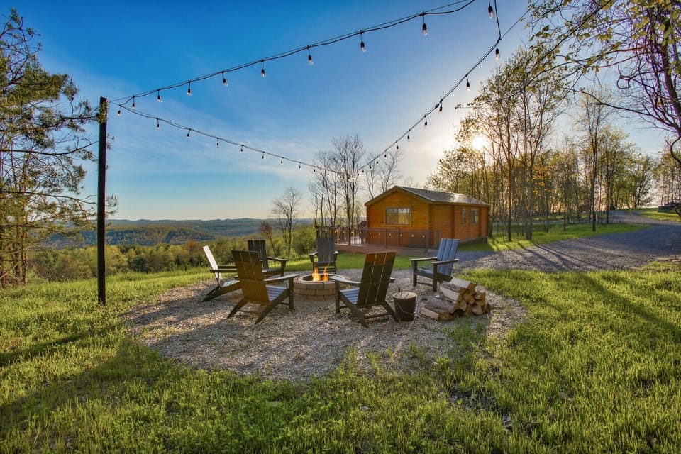 fire pit area with chairs and string lights