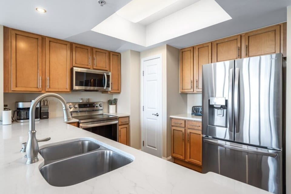 Spacious kitchen with all the comforts of home, Refrigerator with Ice Dispenser.