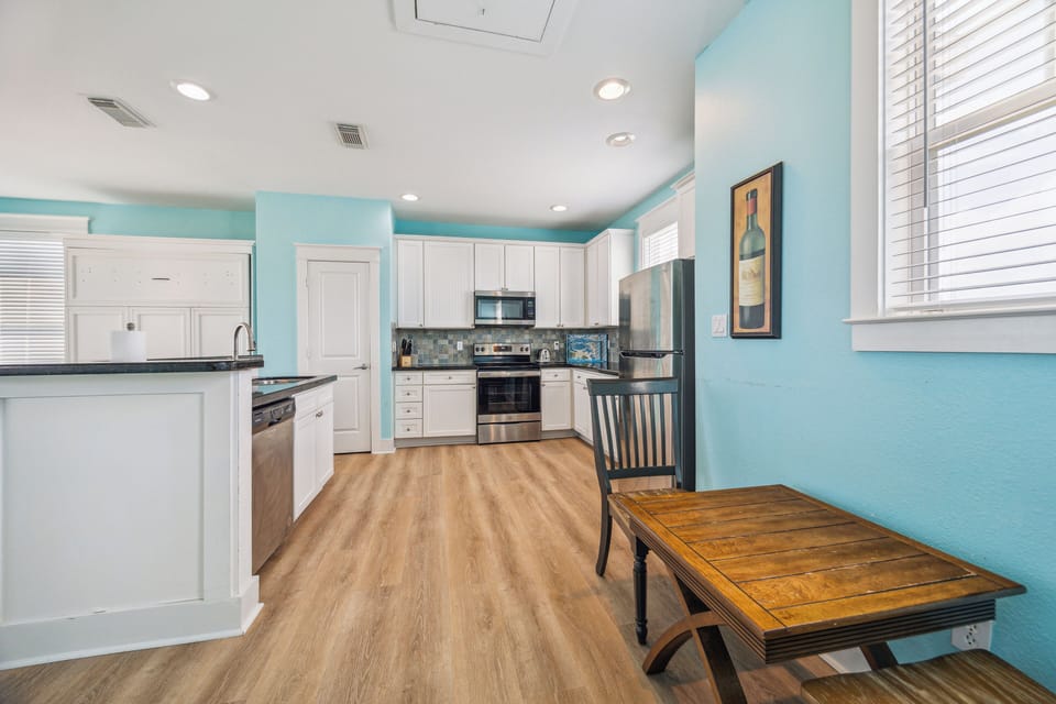 Another view of the kitchen, there's a drop down sofa by the dinning.