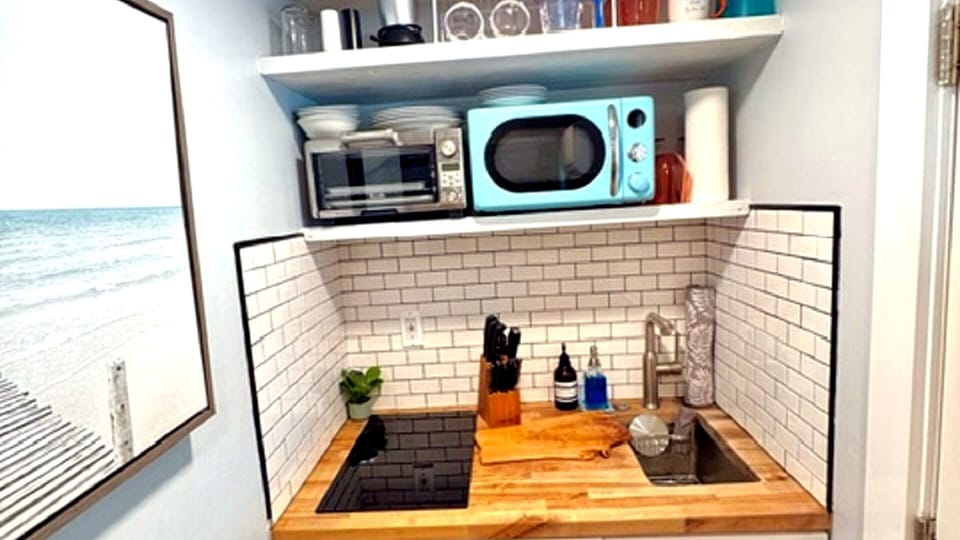 stove top and sink for cooking and washing in mini-kitchen area
