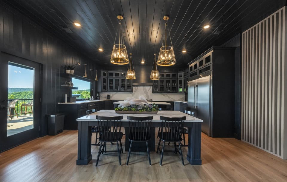 Statement lighting, bold finishes, and room for everyone. A chef-inspired space with a Broken Bow view.