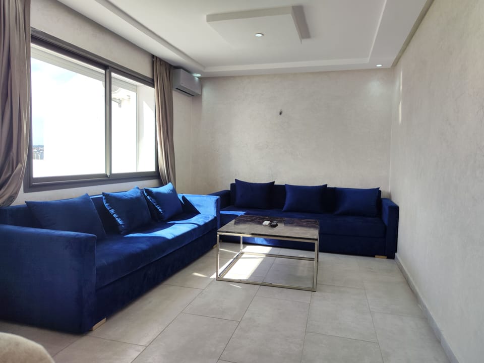 Family Apartment | Living area | 43-inch flat-screen TV with satellite channels