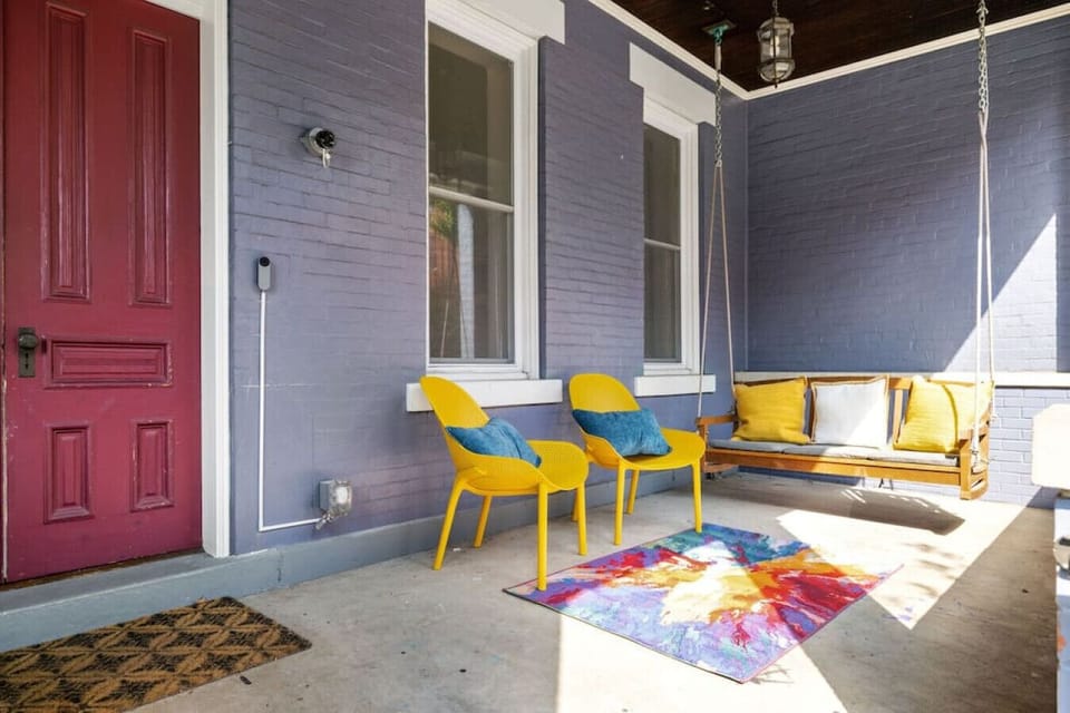 A welcoming porch adorned with comfortable outdoor seating, inviting you to relax and enjoy the great outdoors.