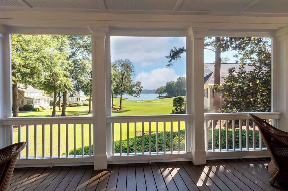 View From The Lower Level Screen Porch - Features Both An Outdoor Sitting Area As Well As Outdoor Dining Table