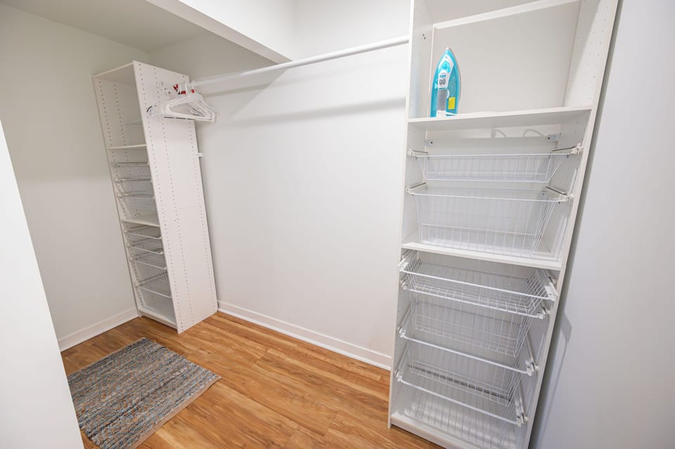 Primary bath walk-in closet, perfect storage for long-term stays!