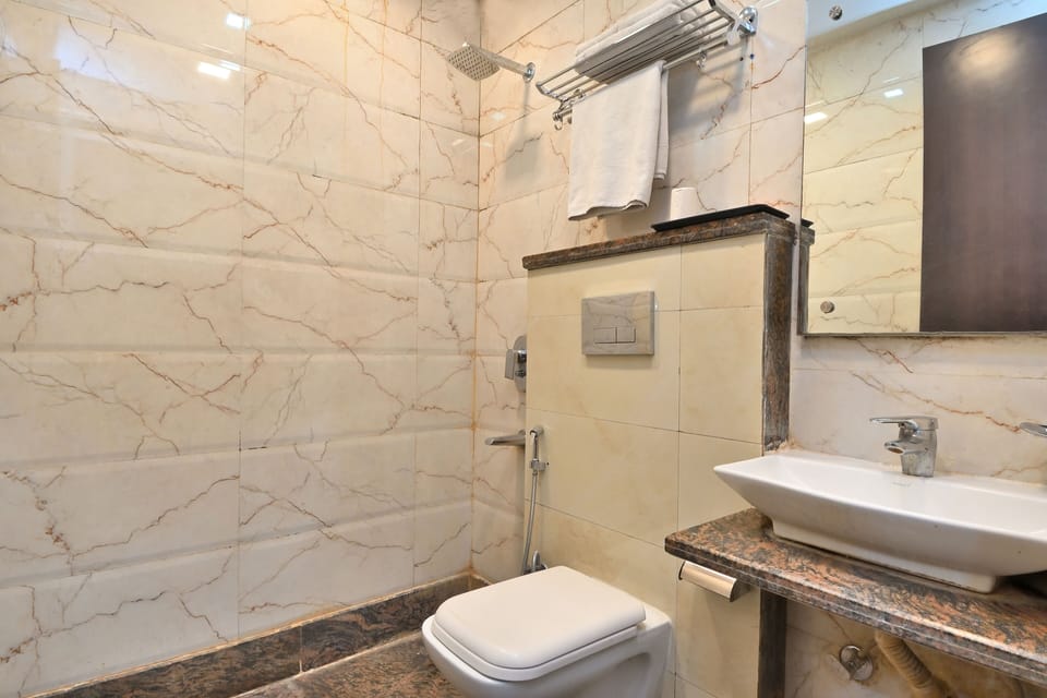 Shower, rainfall showerhead, slippers, towels