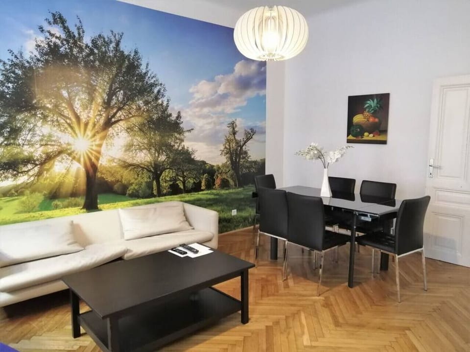 Step into the living room, where Arbio Designers` expertise shines through, creating a warm and inviting atmosphere, perfect for socializing or watching TV.