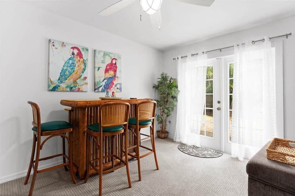 tropical-style bar area with natural light from french doors