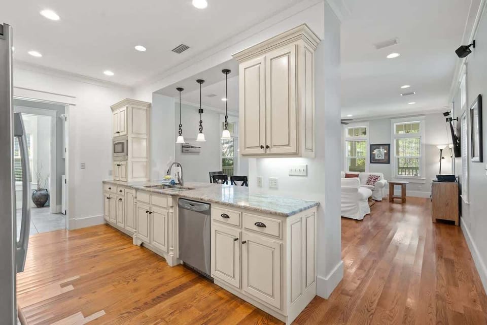 - Cook & dine in style in this beautifully appointed kitchen with essential appliances & extra counter space - Open layout connects to the living area, perfect for entertaining & family meals - Bright, inviting space designed for comfort & convenienc