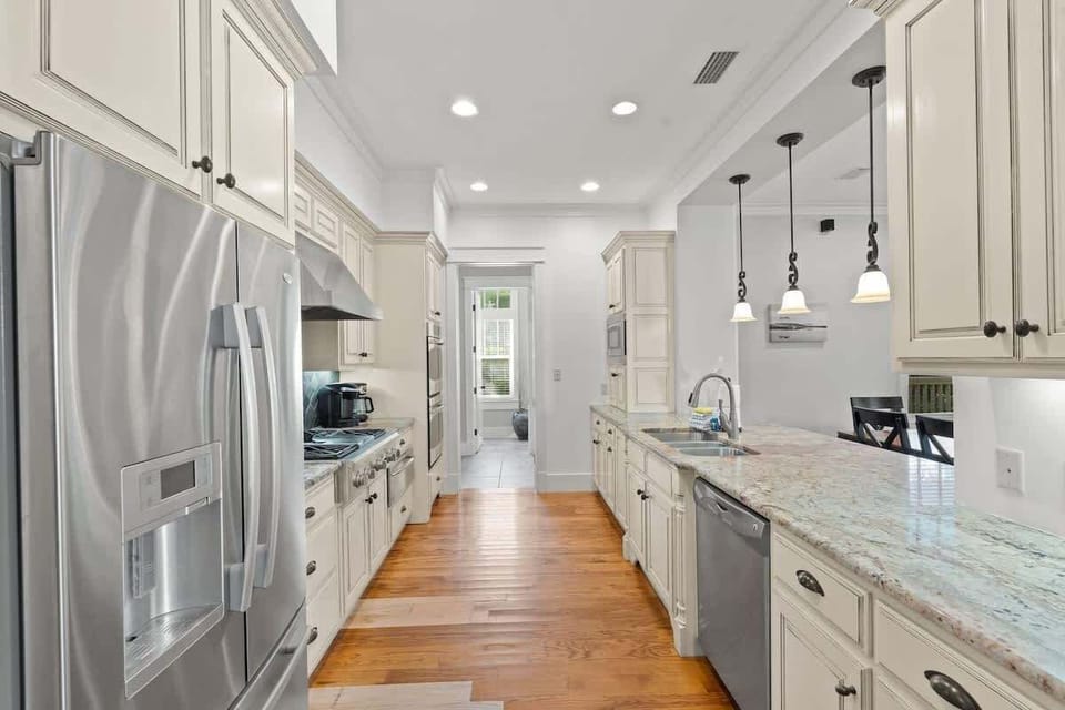 - Spacious kitchen boasts top of the line appliances, perfect for preparing meals & enjoying quality time together - Elegant countertops & extra storage, it’s both functional & stylish - Bright & airy space where cooking & conversation come naturally