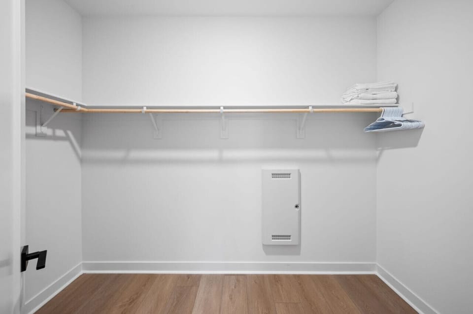 Walk-in closet w/ hanging space & open shelving for organized storage