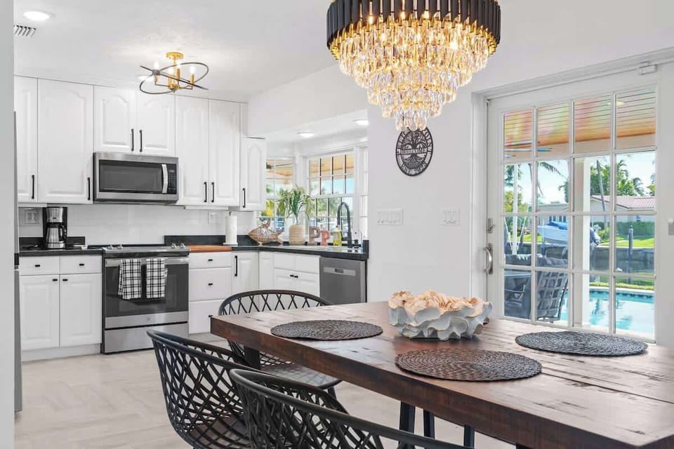A giant chandelier makes this kitchen special