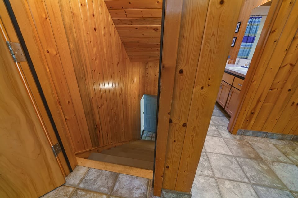 Stairs to downstairs bedrooms and den